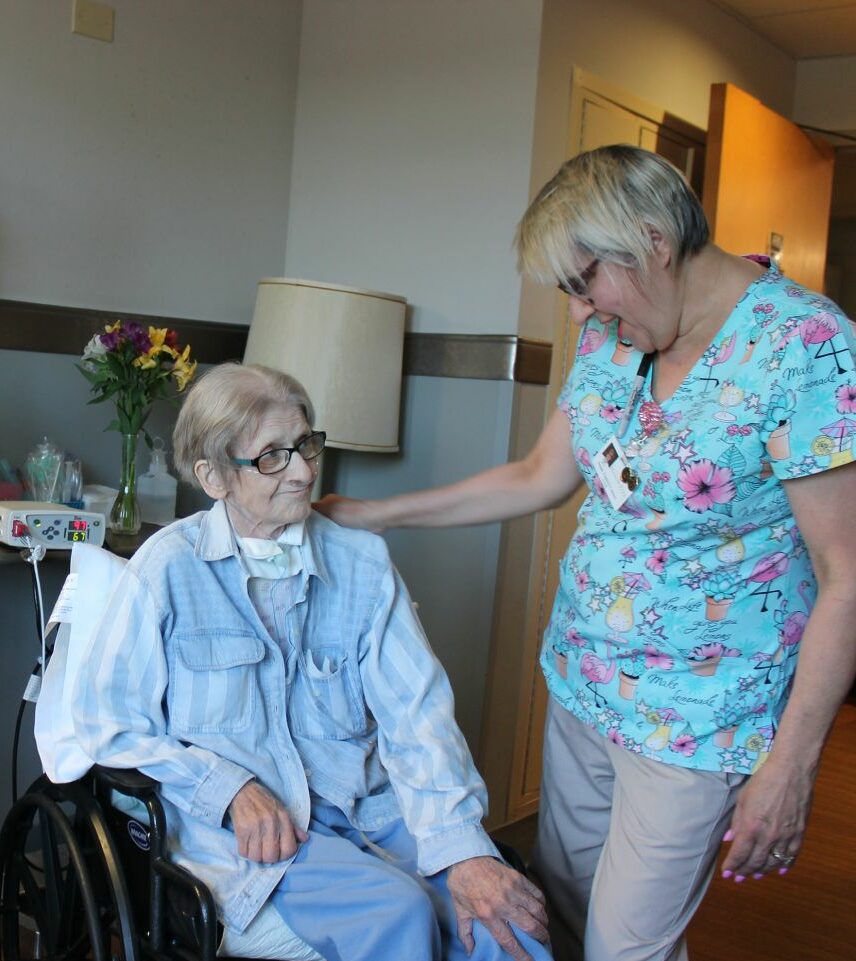 elderly women on ventilator care with nurse