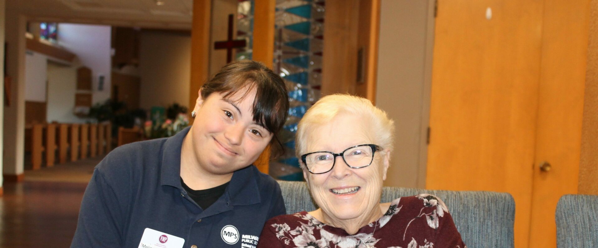 A VMP Milwaukee worker smiling with a member.