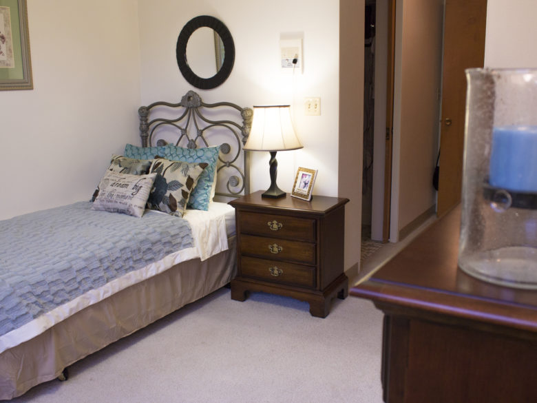 Bedroom in a one bed assisted living apartment at VMP Milwaukee.