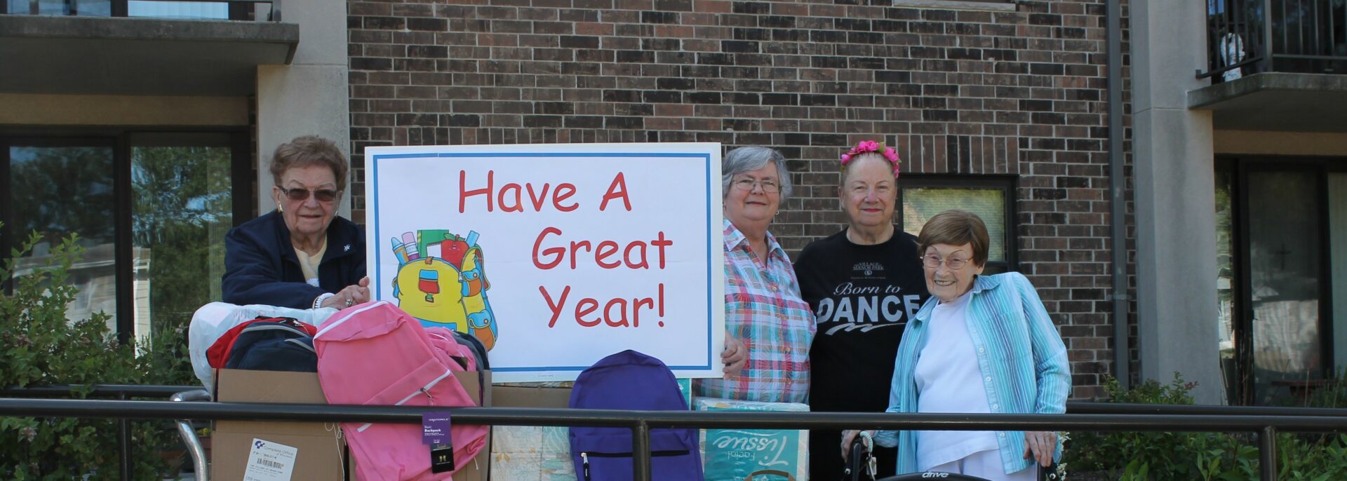 A group of people standing outside VMP with donations.