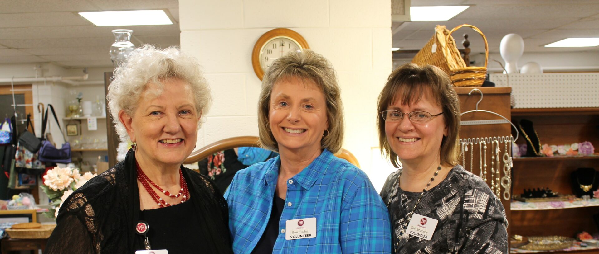 Three ladies smiling.