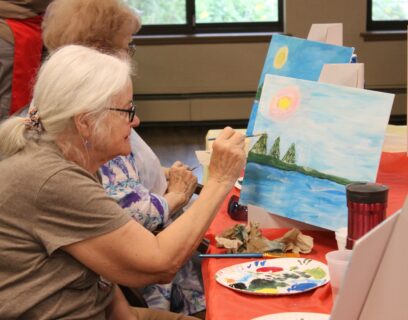 VMP West Allis Senior Community Club senior lady painting at paint and sip