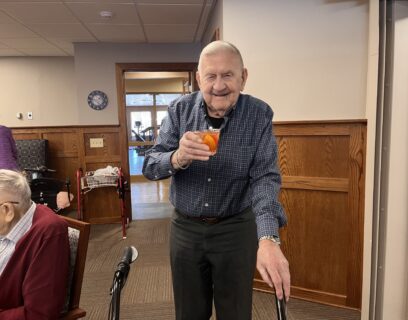 VMP West Allis Senior Community Club senior man enjoying a cocktail smiling