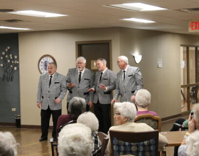 VMP Senior Community Club entertainers, four senior men singing as a quartet