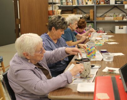 VMP Senior Community Club senior ladies creating luminaries in a craft event
